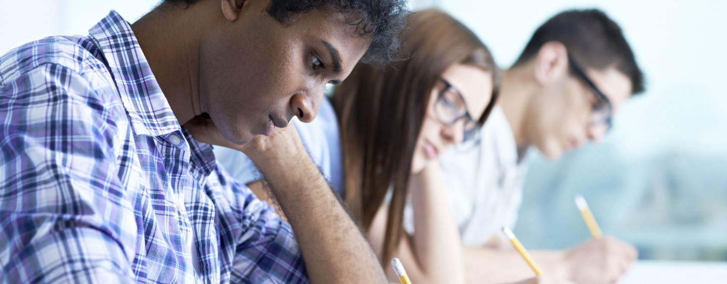 A diverse student body concentrating while taking a test